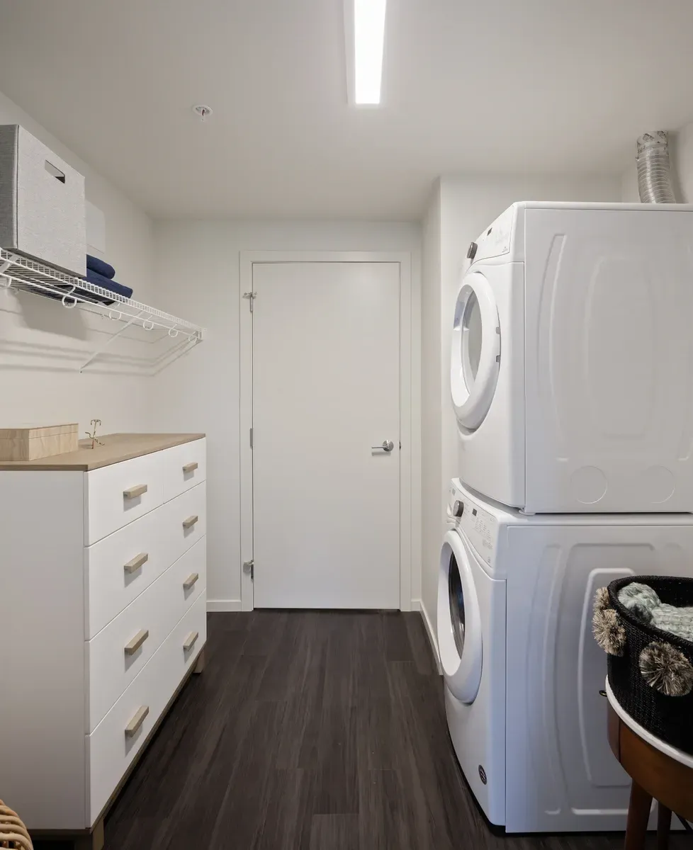 A white washing machine and dryer in a laundry room.