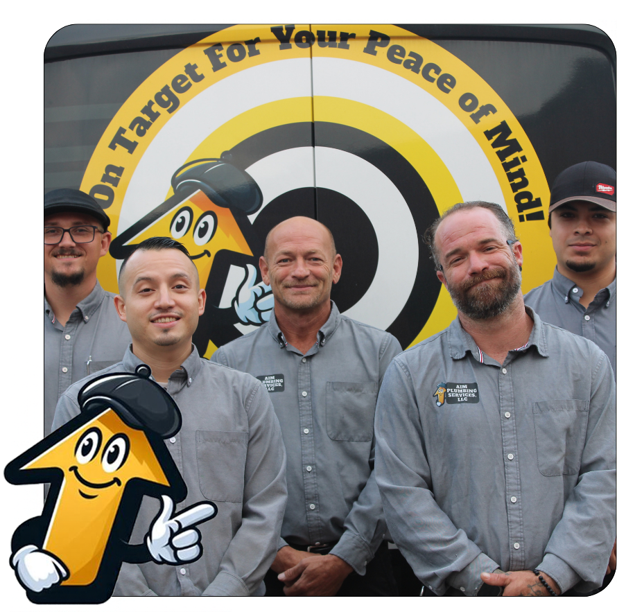 Group of men in blue shirts in front of a yellow vehicle with the text 