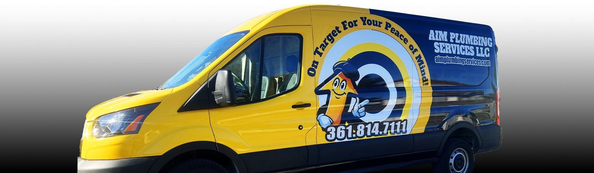 Yellow and blue company van with a ram logo and text.