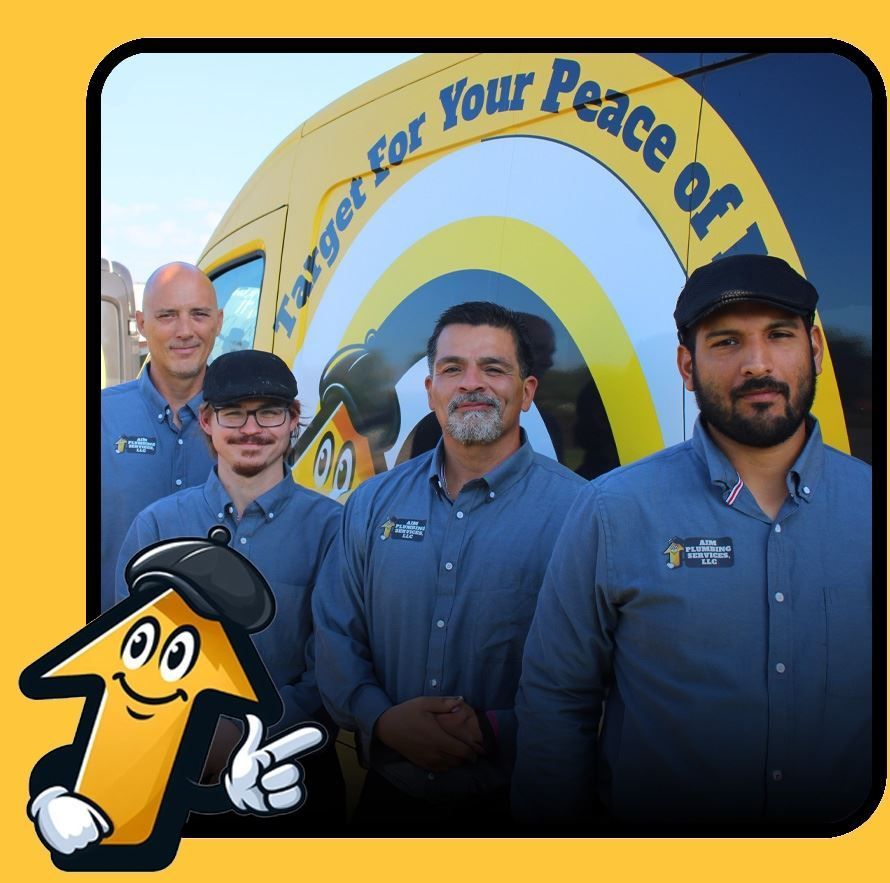 Men in blue shirts stand in front of a van with 