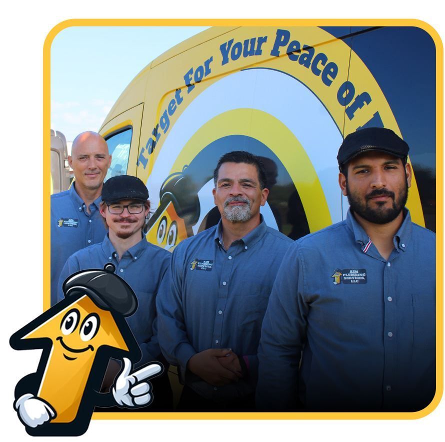 Team in blue shirts posing near a vehicle with 