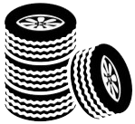 Stack of black and white tires, with one tire leaning against the stack.