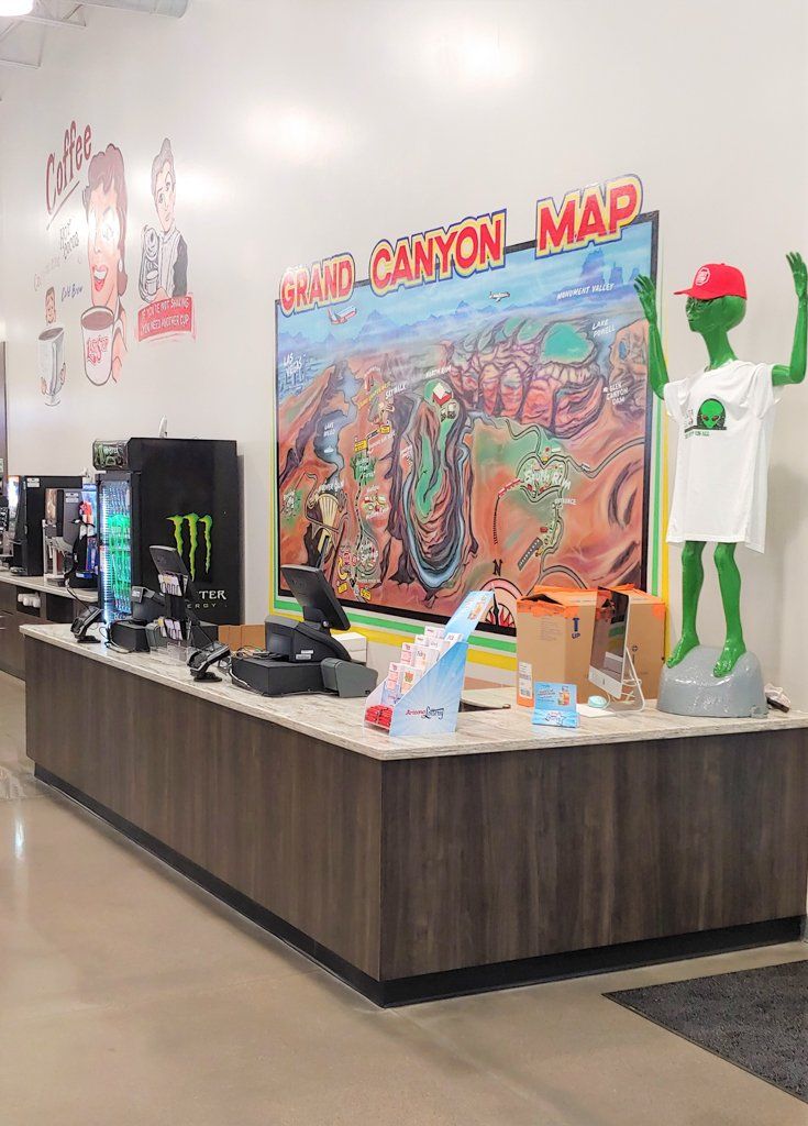 Cash register with alien decor at the Last Stop Travel Center near Las Vegas