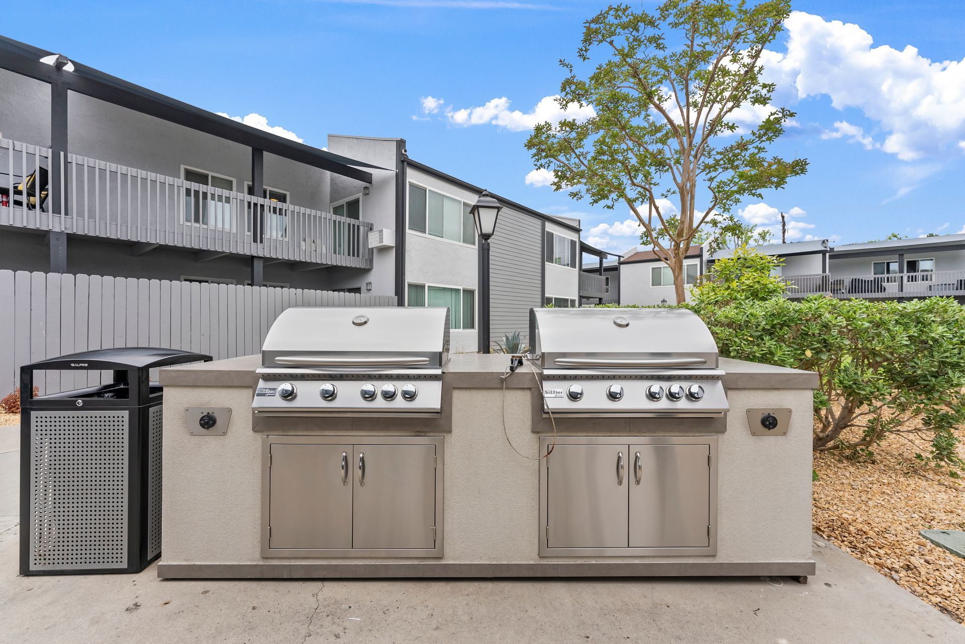 Exterior photo of The Edward Apartments -BBq Grills