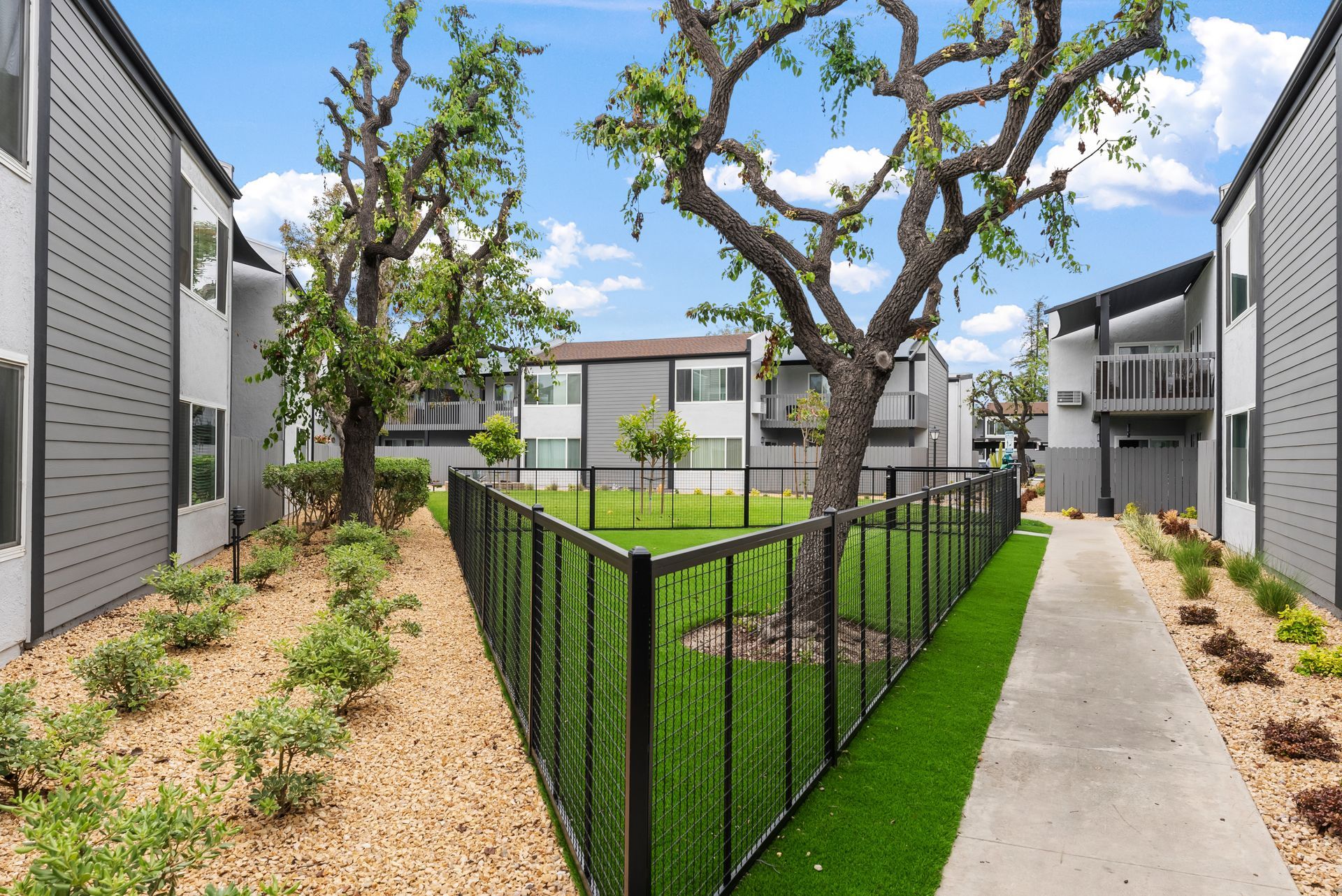 Exterior photo of The Edward Apartments -Grassy Area