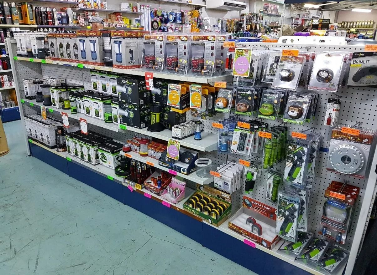 Shelves in a Store Filled With Packaged Electronics and Accessories — True Blue Camping Warehouse in North Mackay, QLD