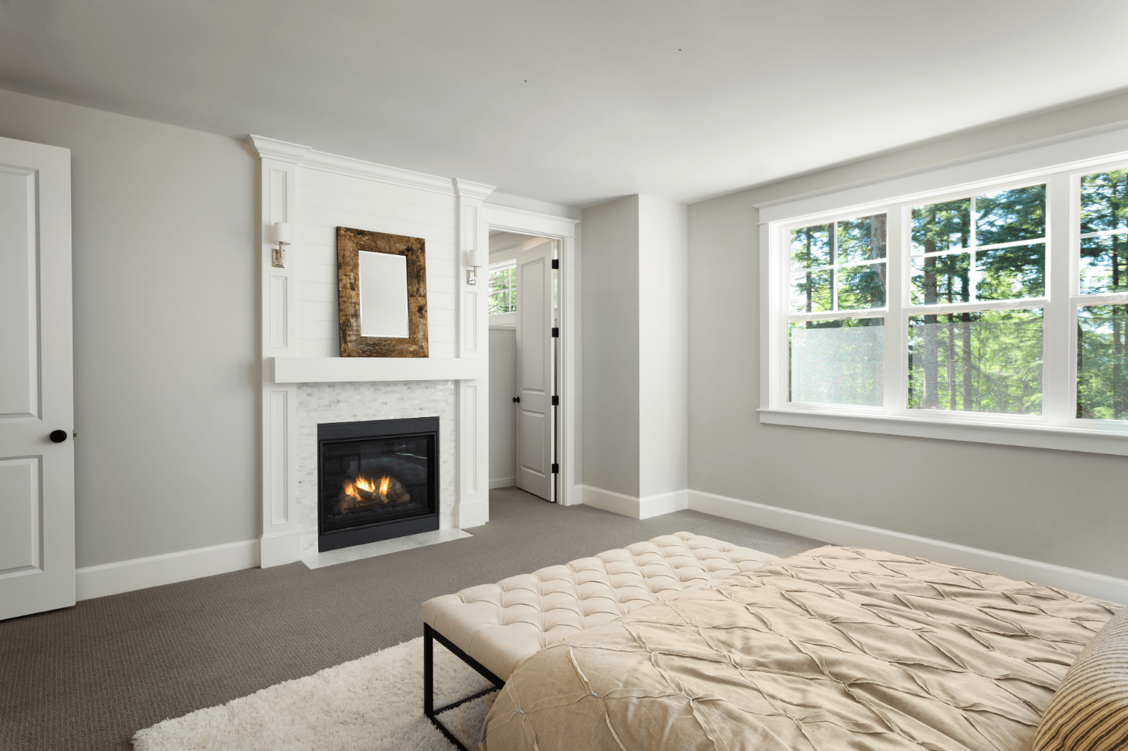 New replacement windows in a bedroom. The casement windows are white and were installed in Prince Edward County Ontario by Belleville Windows and Doors.