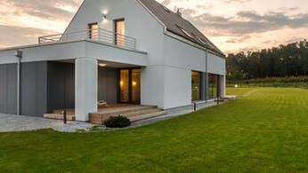 Picture of exterior house siding.  The siding is vinyl and has a modern look.  The house is in Prince Edward County near Toronto Ontario.