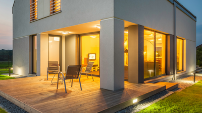 New sliding doors on the exterior of a modern-looking house.  The sliding glass doors were installed through Belleville Windows and Doors.