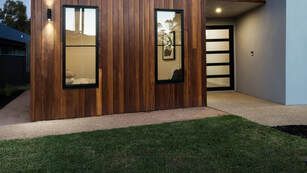 Picture of a contemporary black front door.  The door is on a modern wood house in Belleville Ontario installed by a window company.