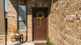 Picture of a new wood front entry door installed in Belleville Ontario.  The door was installed by window contractors with Belleville Windows and Doors.
