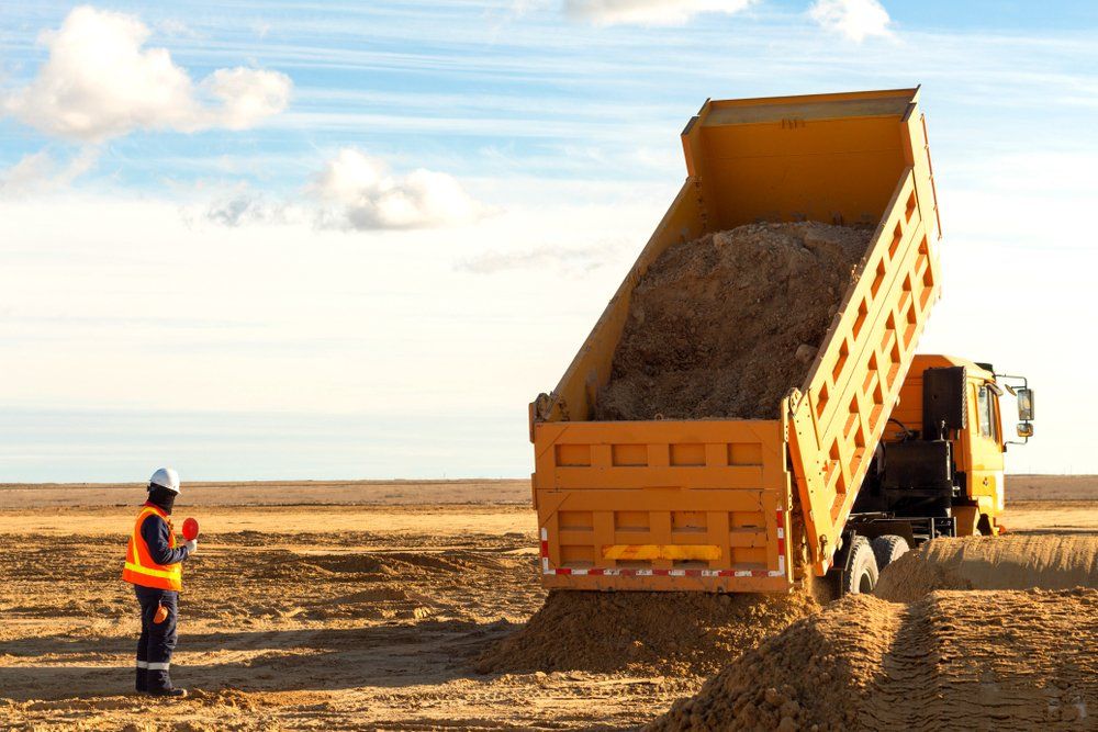 Orange Tipper Truck — Excavators in Wedderburn