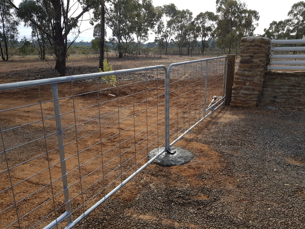 Worker Mowing Lawn — Excavators in Wedderburn