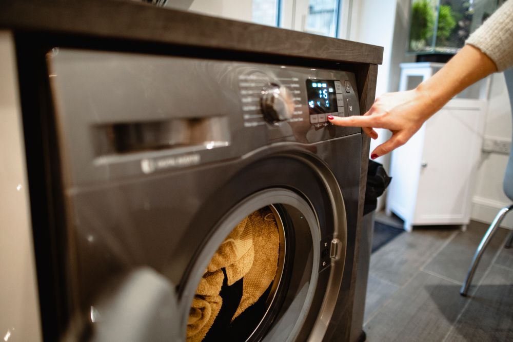 Pressing a Button on Washing Machine — Syracuse, NY — Automatic Appliance Service II
