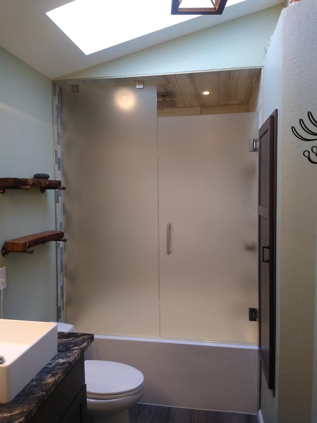 Custom frameless shower enclosure