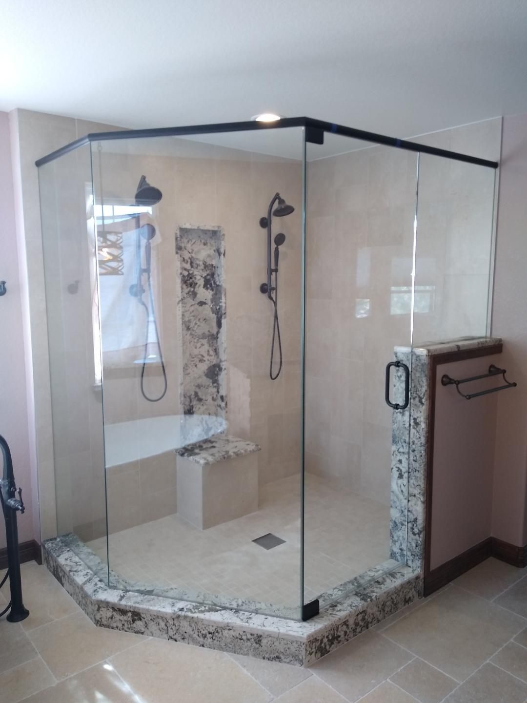 Semi-frameless shower enclosure