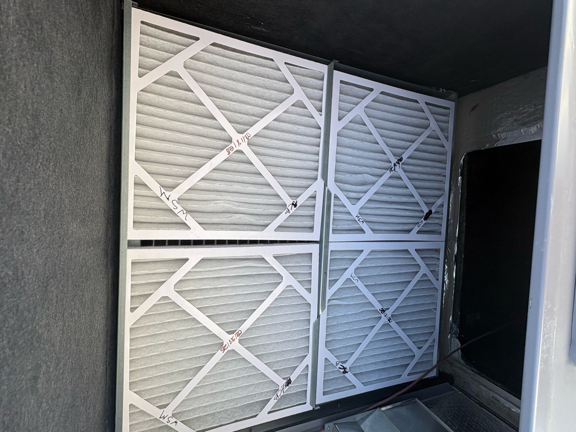 White air filters set inside large Hvac system