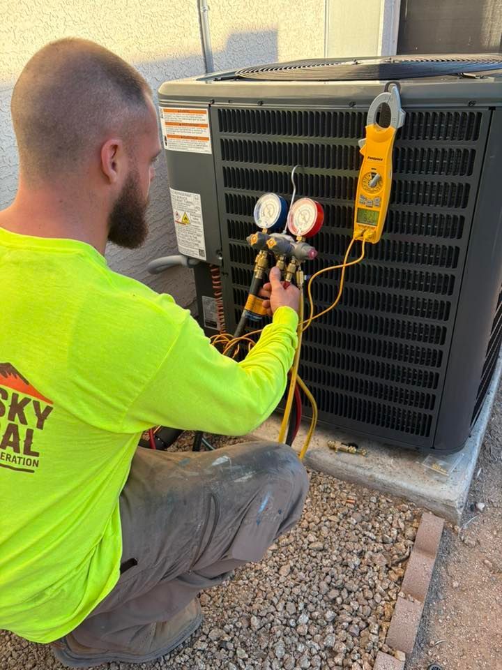 Western Sky Mechanical technician repairing AC unit in Phoenix
