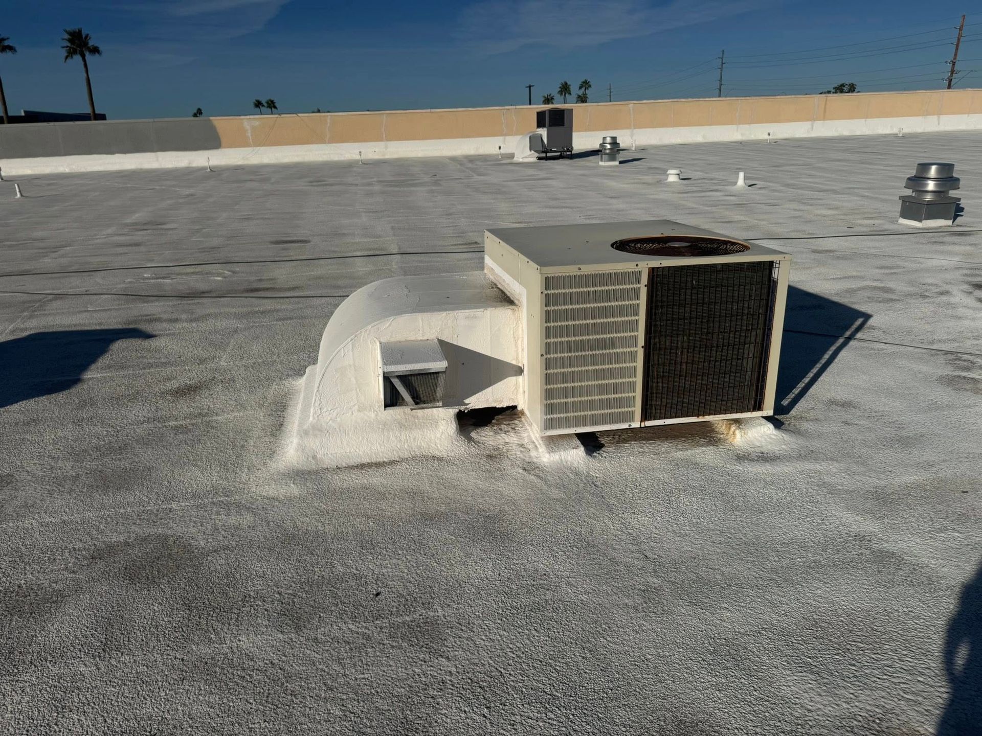 Roof HVAC unit with damaged panel on a flat rooftop Phoenix AZ