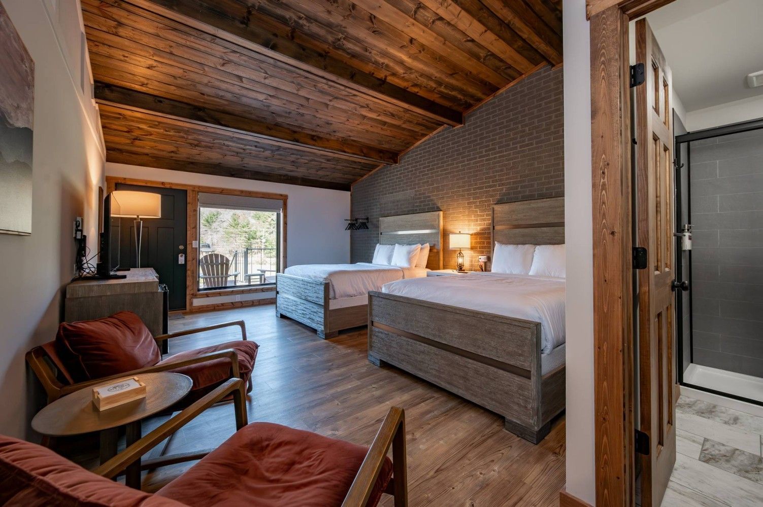 Double Queen Bedroom with two queen beds and pool view deck