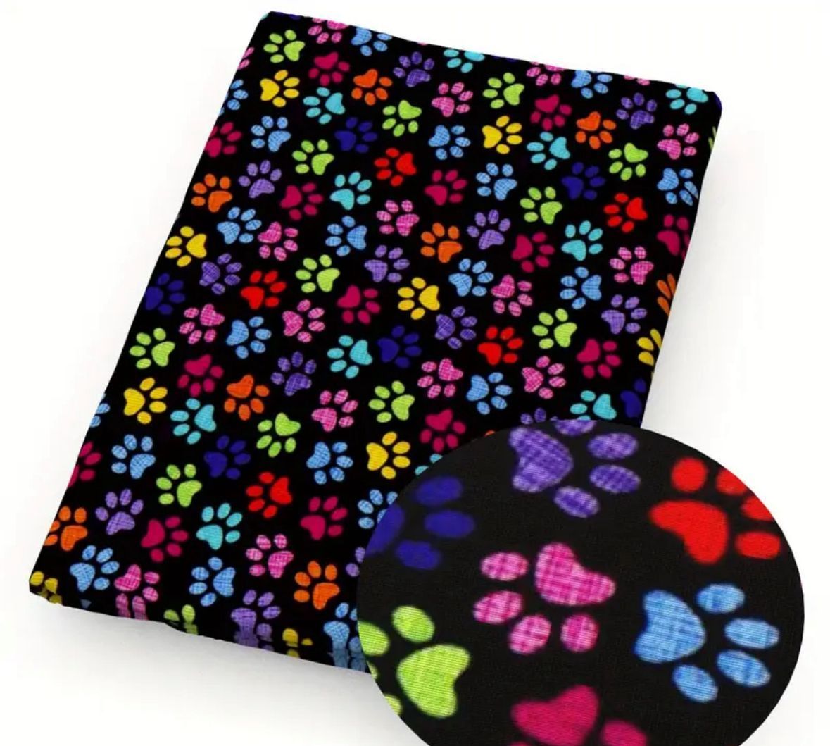Black fabric with colorful paw prints.