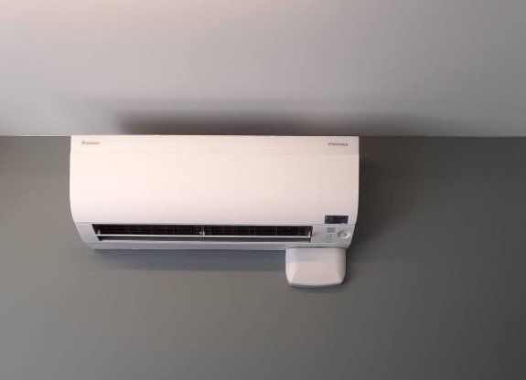 Hi wall heat pump on grey wall