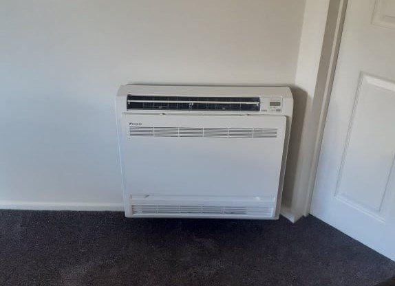 Installed floor console heat pump.