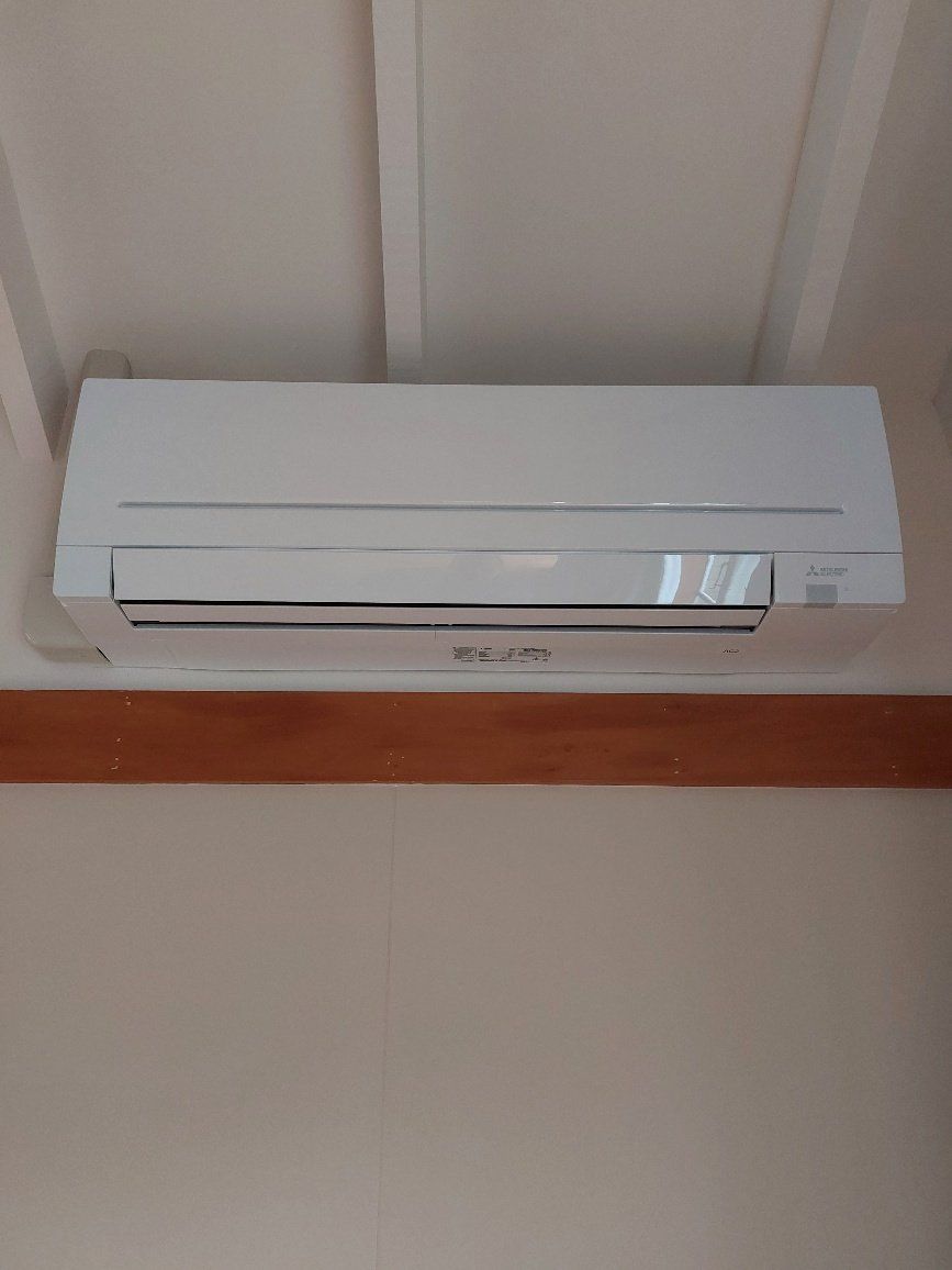 Hi-wall installed heat pump.