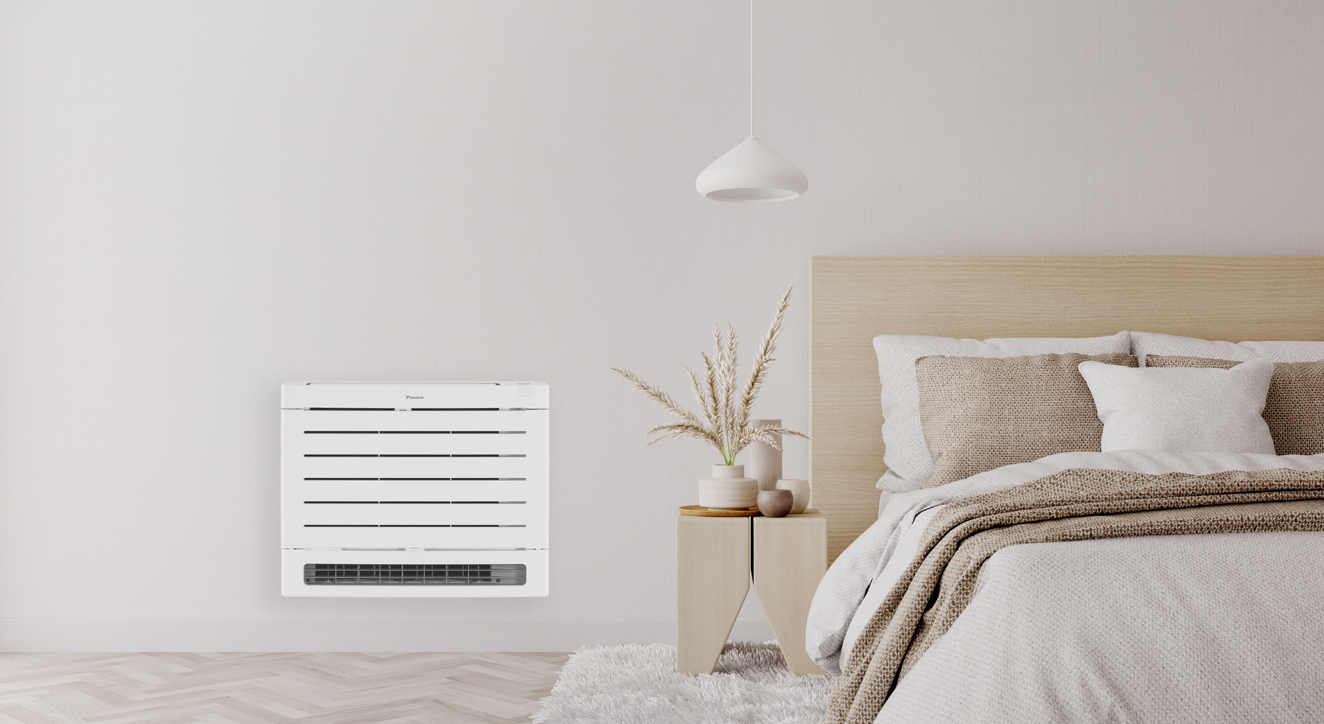 Daikin Aura Floor Console heat pump in a bedroom