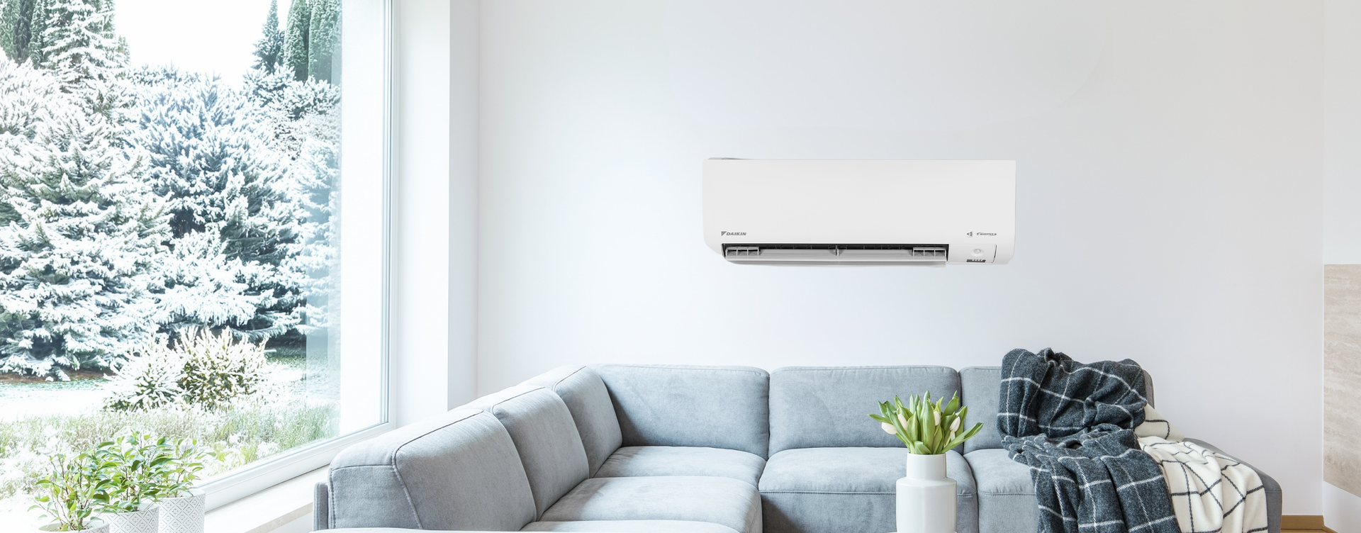 Daikin Alira X heat pump on wall in living room 