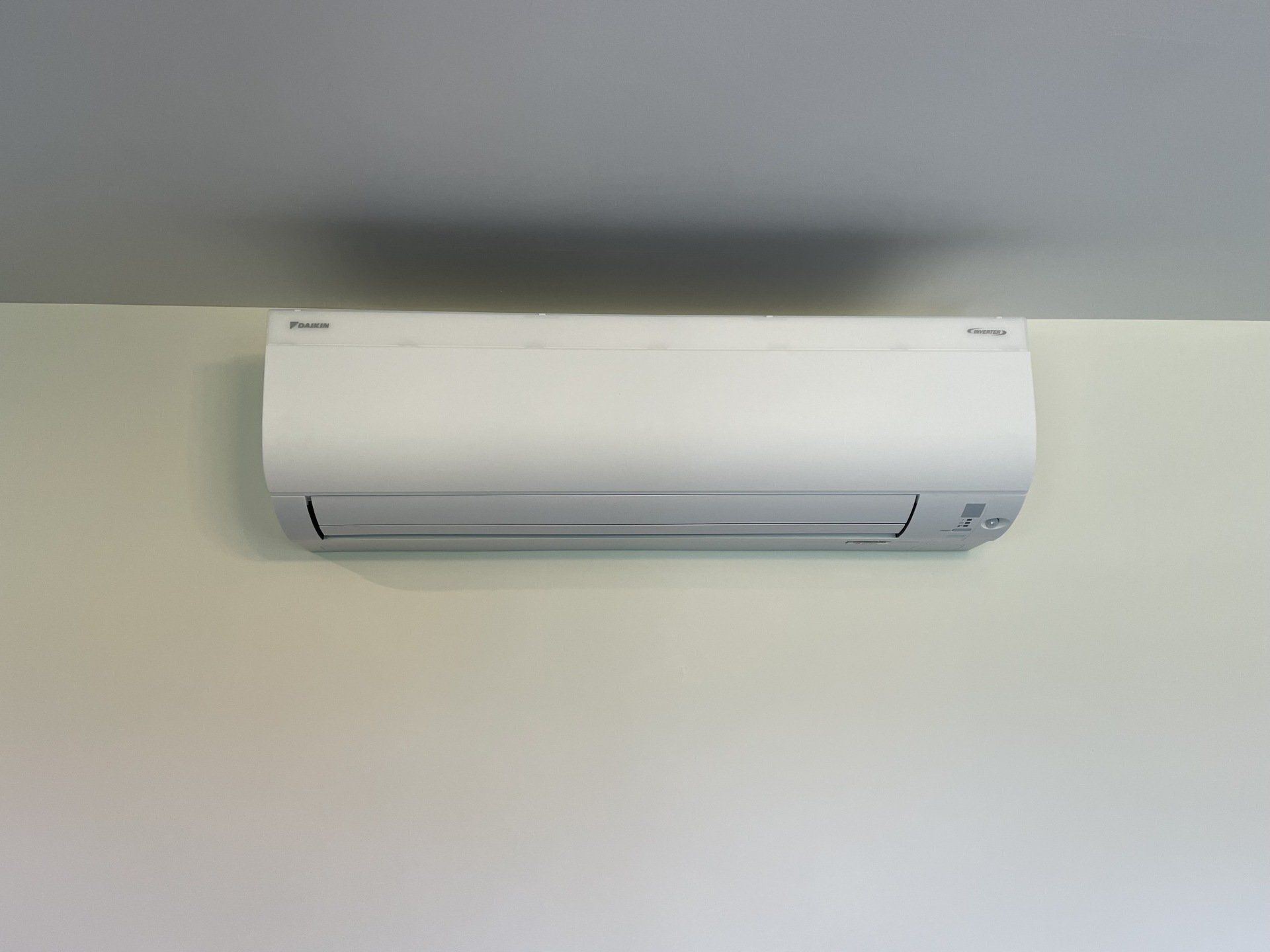 Hi-wall heat pump installed on wall