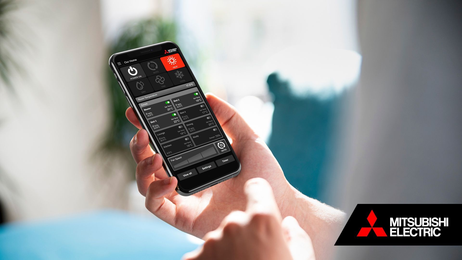 Mitsubishi Electric zone app on mobile phone being held in person's hand.