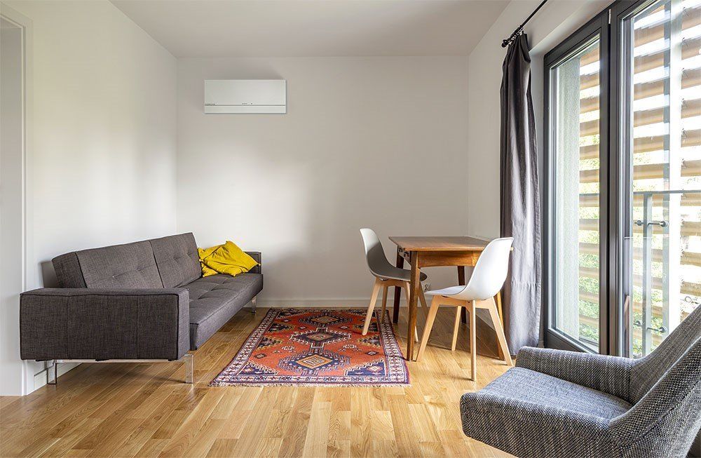 Mitsubishi Electric Air Conditioning Hi-Wall Heat Pump in Small Lounge Room