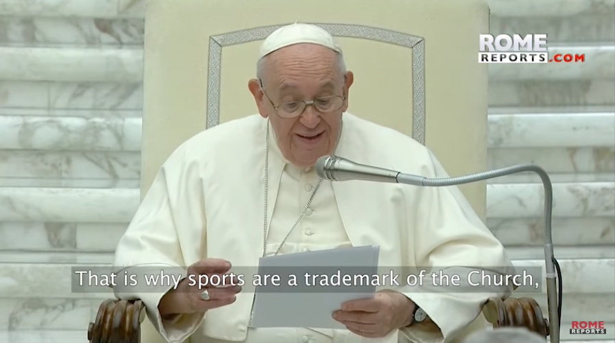 Pope Francis reading at a lectern in a white papal robe, with a quote caption on screen.