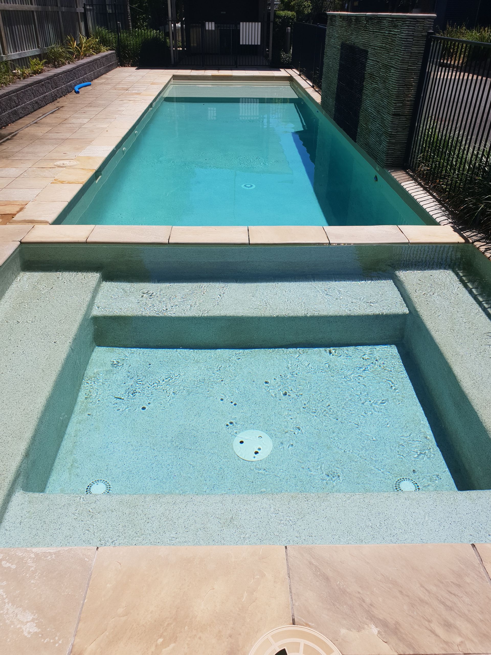 A Swimming Pool With Stairs Leading To The Water — Kingscliff Pool Shop In Kingscliff, NSW