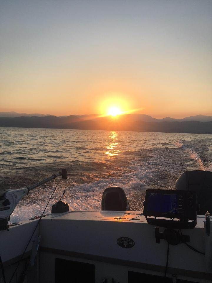 The sun is setting over a body of water