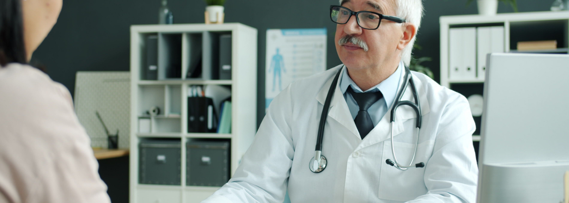 Picture of a doctor in consultation with a patient. 