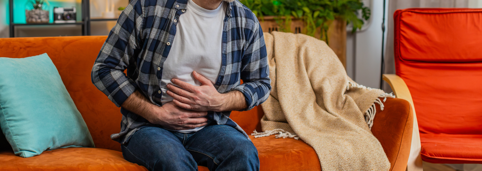 Picture of someone holding their stomach because they are hungry. 