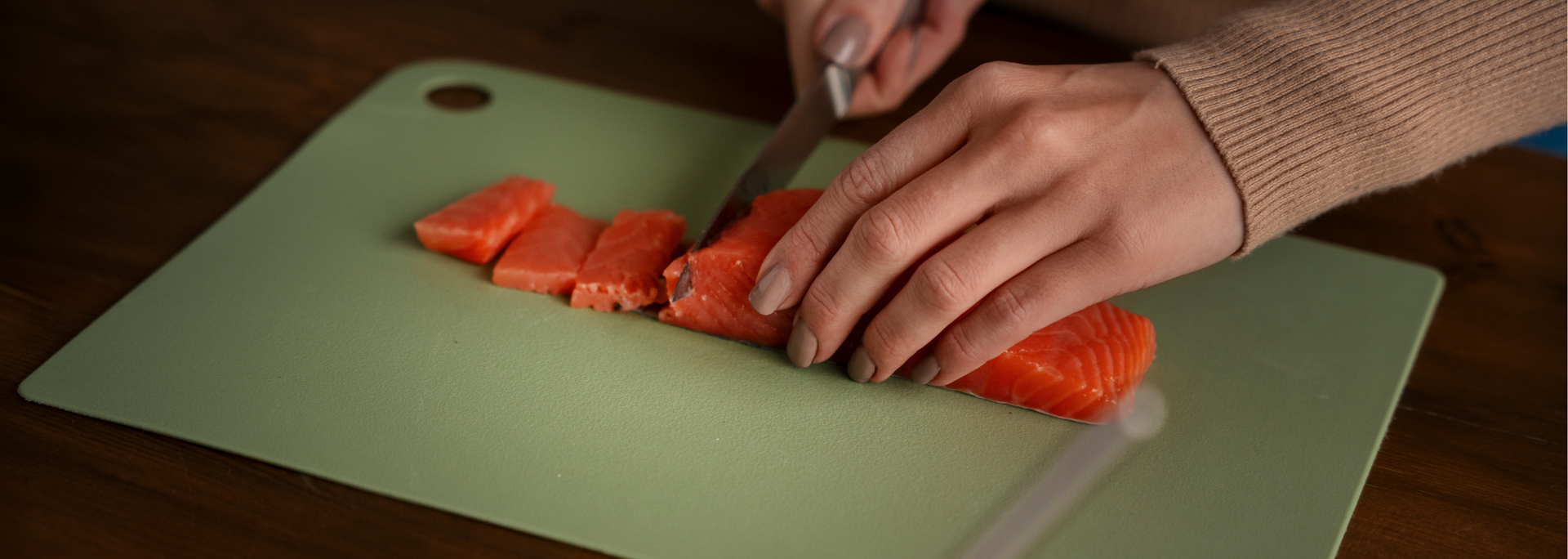 Picture of someone cutting salmon. Picture of someone cutting salmon.