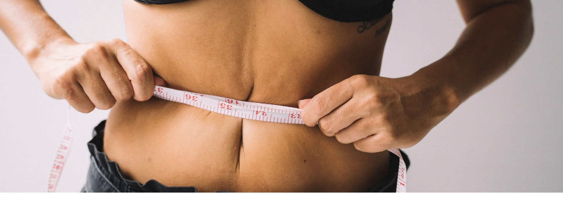 Picture of a measuring tape around a waist. Picture of a measuring tape around a waist.