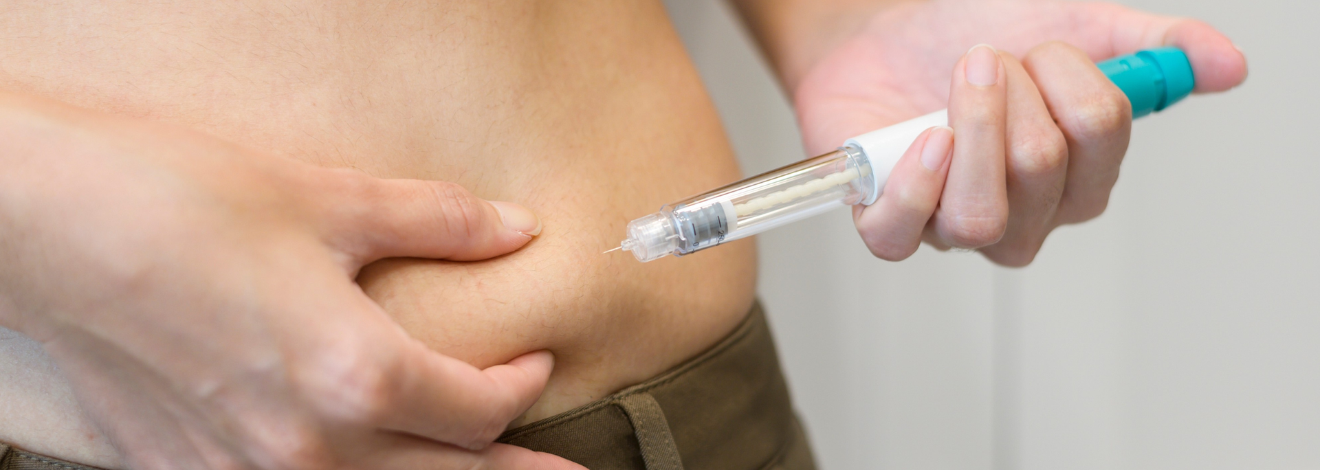 Picture of a person using an injection pen. Picture of a person using an injection pen.