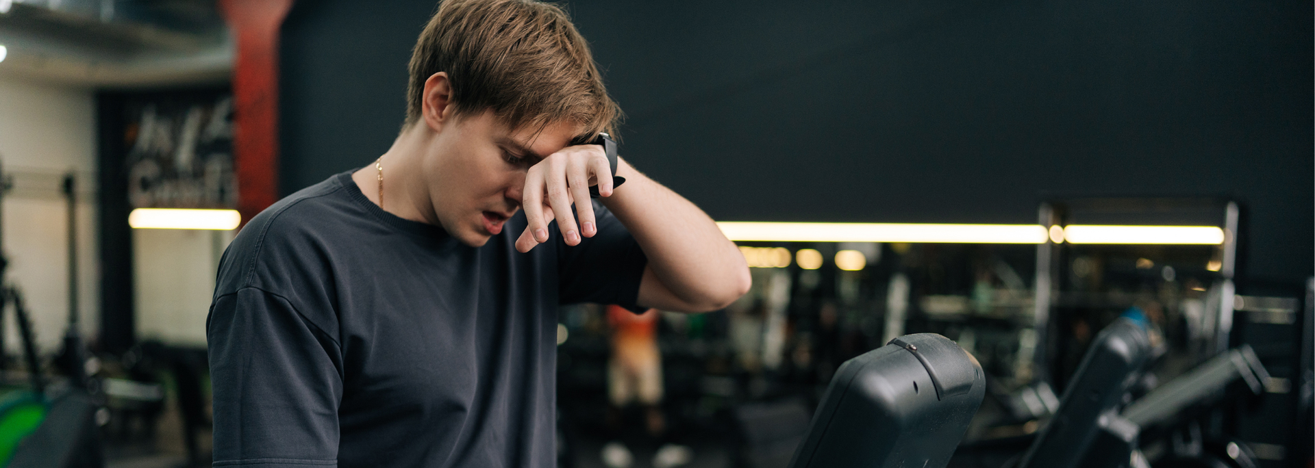 Picture of a person looking tired at a gym. Picture of a person looking tired at a gym.