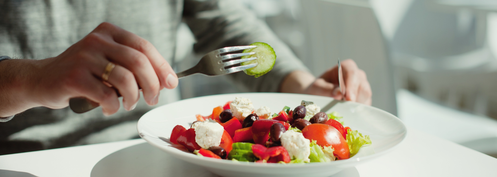 Picture of a person eating a healthy plate of food. Picture of a person eating a healthy plate of food.