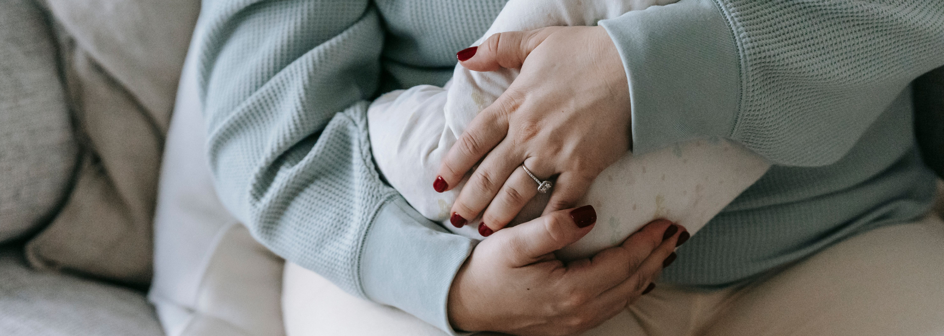 Picture of a woman holding a baby. 