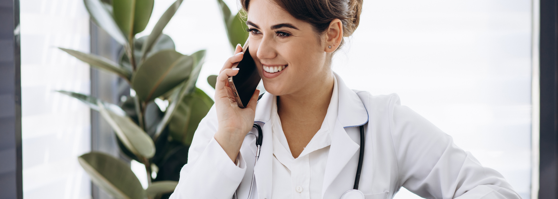 Picture of a happy doctor on the phone.. 