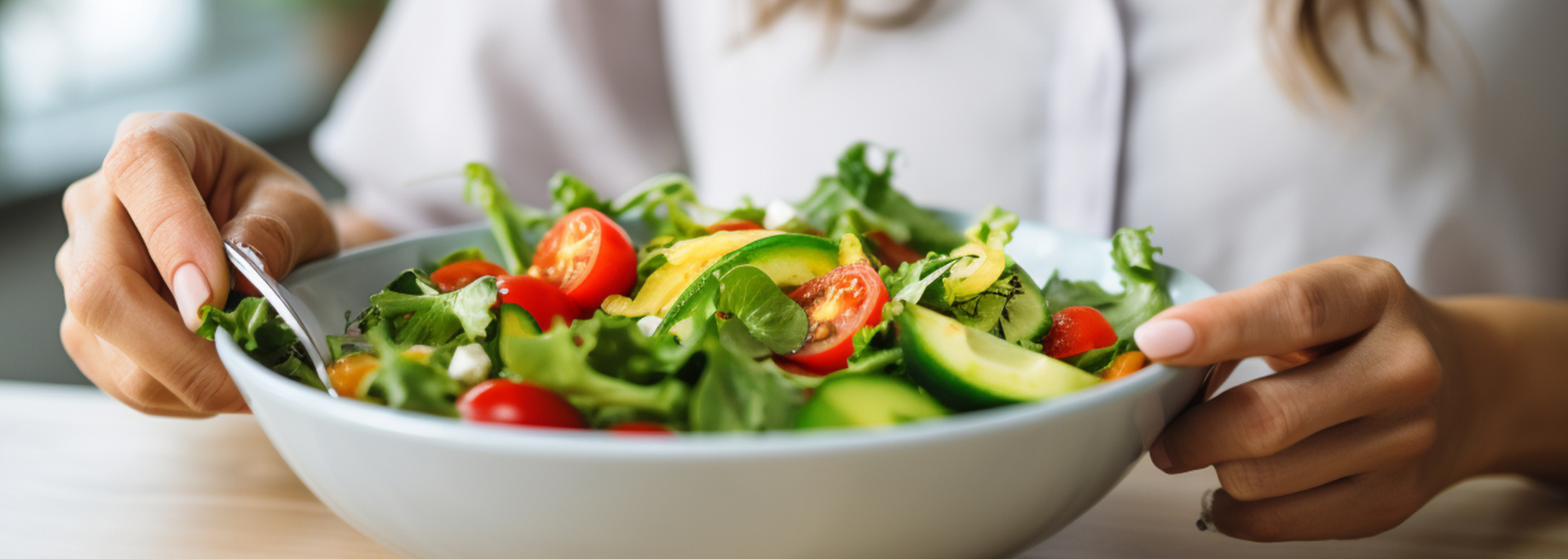 Picture of someone eating a salad. Picture of someone eating a salad.