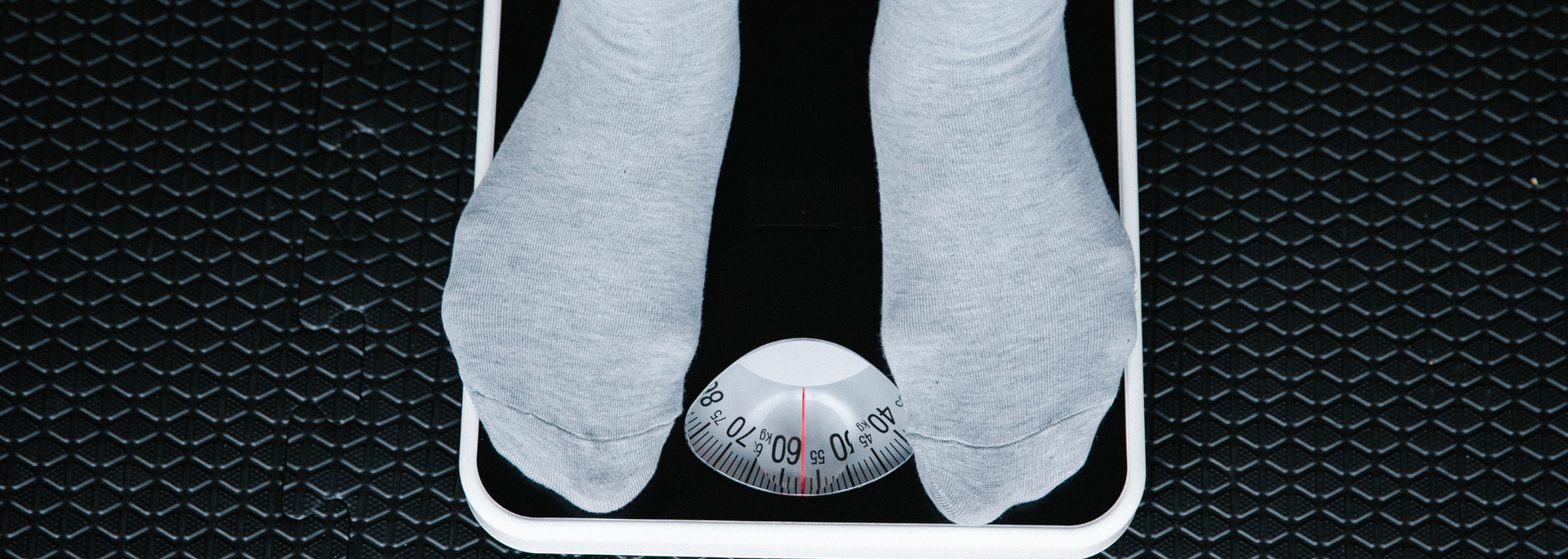 Picture of someone on scales. 