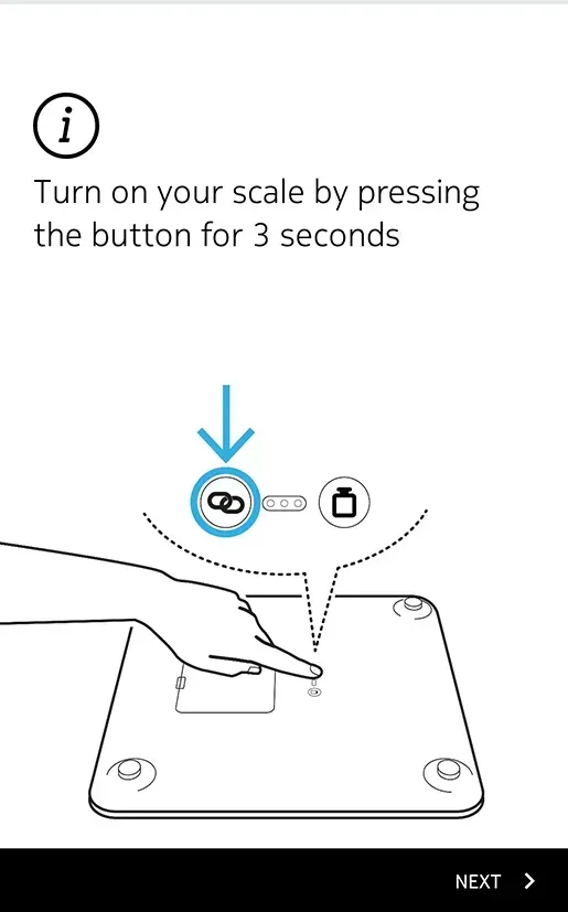 A person is pressing a button on a scale.