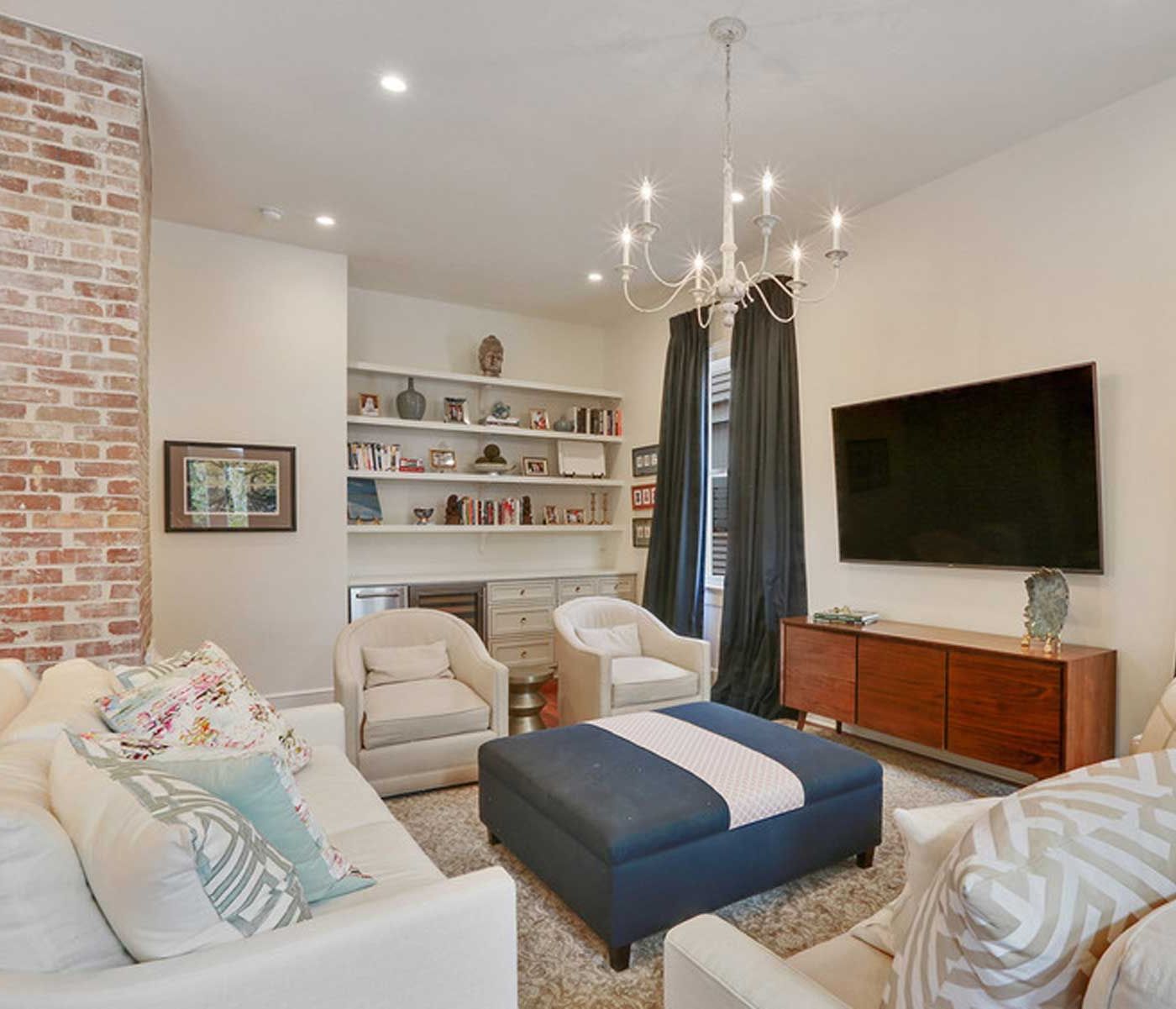 A living room filled with furniture and a flat screen tv