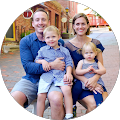 A family is posing for a picture together in a circle.